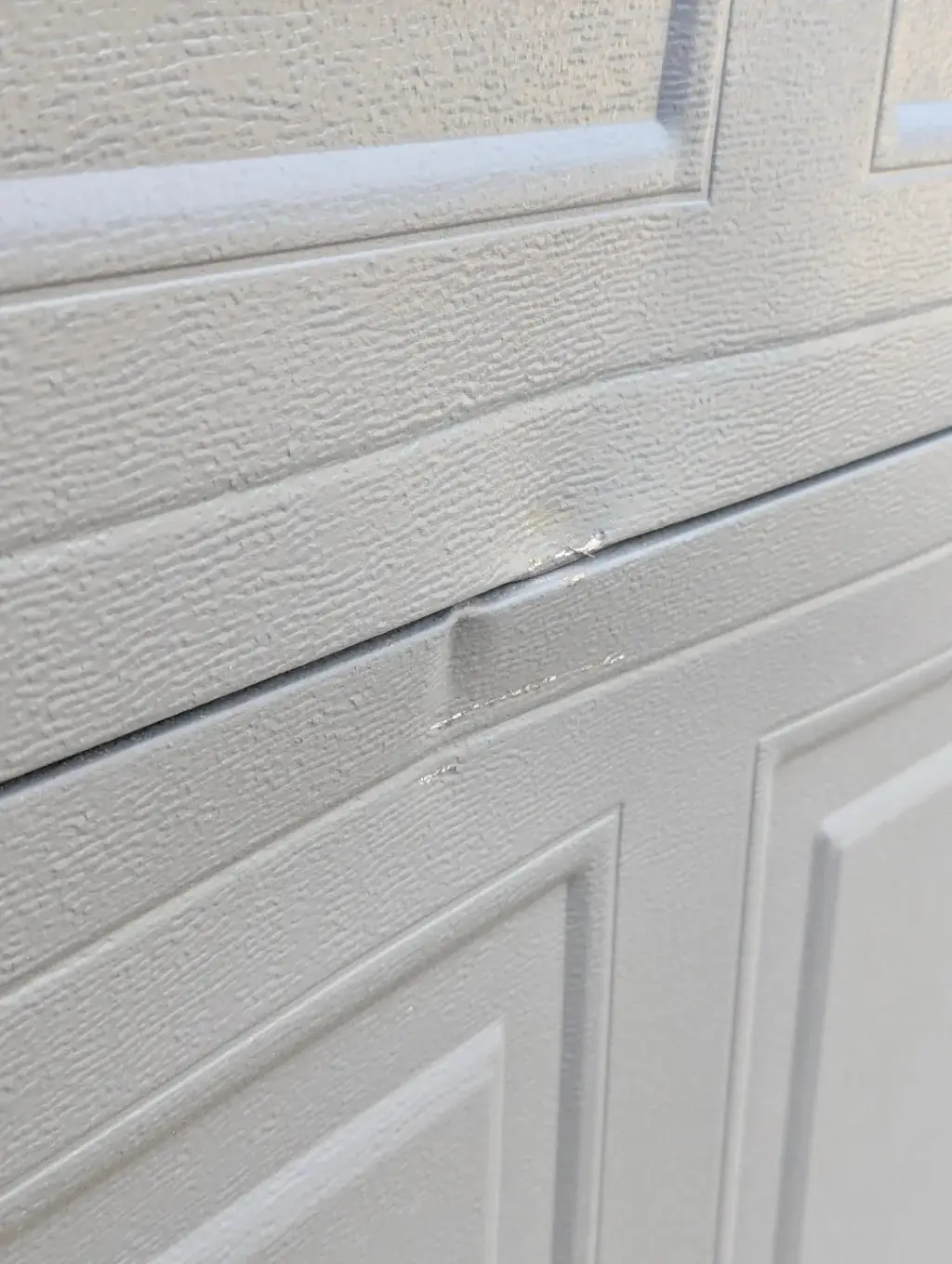 Dented Garage Door